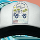 Black and white trucker hat featuring the slogan “Jeep Hair, Don’t Care” with a clear Hawaiian vibe.